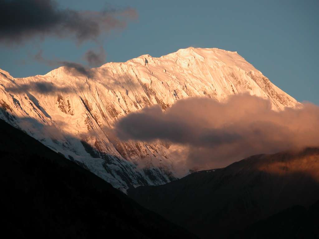 Annapurna 13 03 Grande Barriere Sunrise From Manang The Grande Barrire shone in the morning sun from Manang. This 10km long wall of rock, ice and snow was named by Maurice Herzog in 1950. The highest portion of the Grande Barriere at the far right is called Tilicho Peak (7134m), which was first climbed via the northwest shoulder on October 10, 1978 by Emmanuel Schmutz of France.